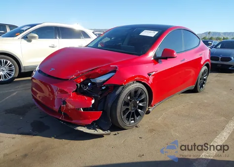 2023 Tesla Model Y Awd/Long Range Dual Motor All-Wheel Drive z USA, uszkodzony, nr VIN 7SAYGDEE1PF668687